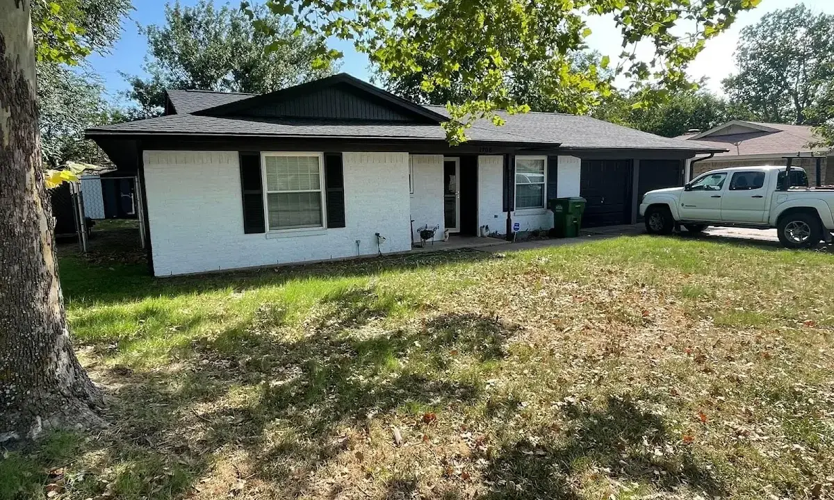Professional roofing crew working on a residential roof in El Dorado
